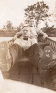 USA 2 Young Men Lying in Boat Feet in Foreground Old amateur Snapshot Photo 1920